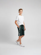 GREEN LYCRA PLAIN SHORTS WITH 2 SIDE ZIPPERS